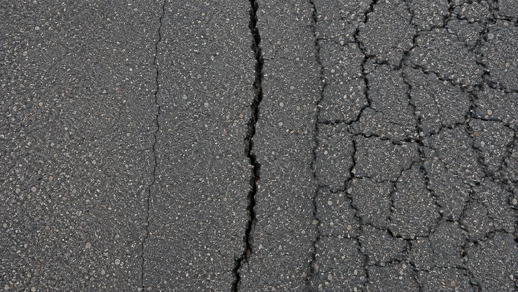 Close-up comparison of hairline cracking, a quarter-inch crack, and alligator cracking on an asphalt driveway
